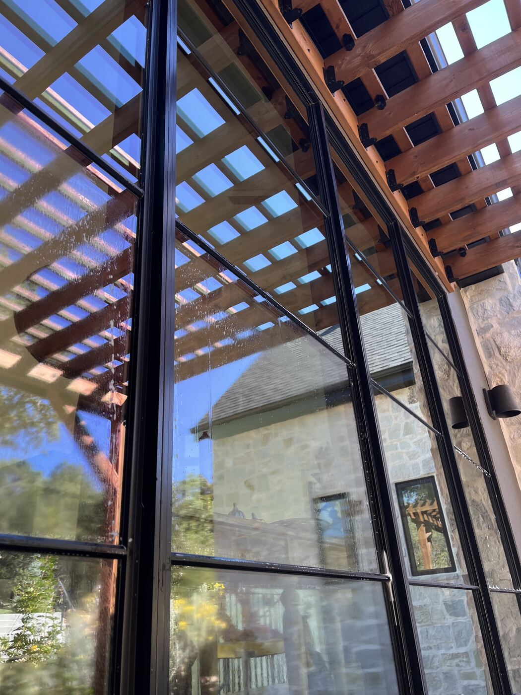 Glass wall under a pergola